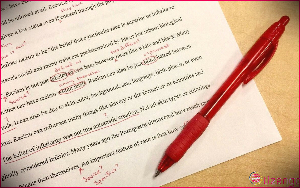 Un morceau de papier et un stylo rouge